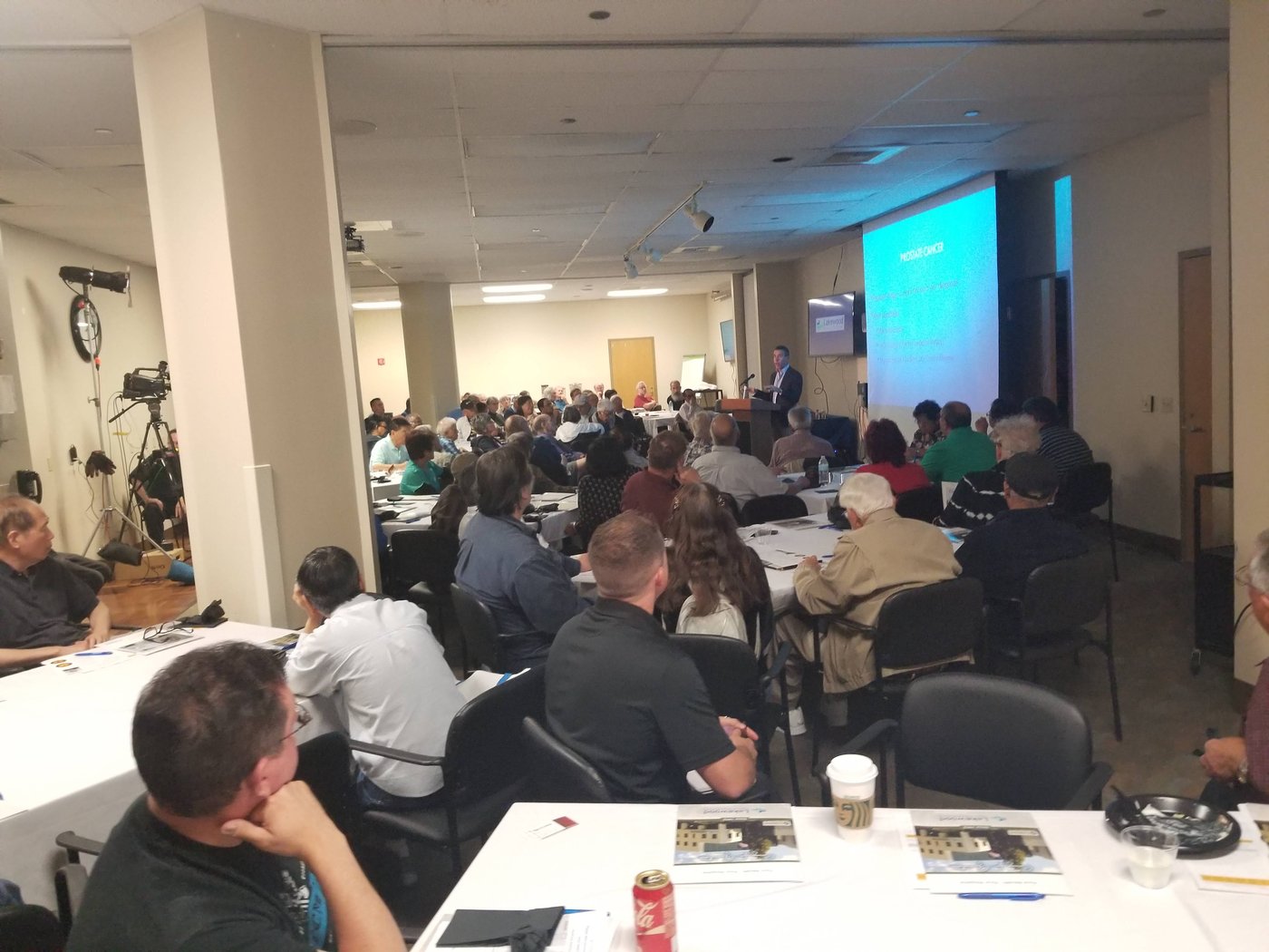 Packed Dinner with a Doctor event — Dr. Jonathan Perley presenting on prostate cancer to a full community audience at Lakewood Regional