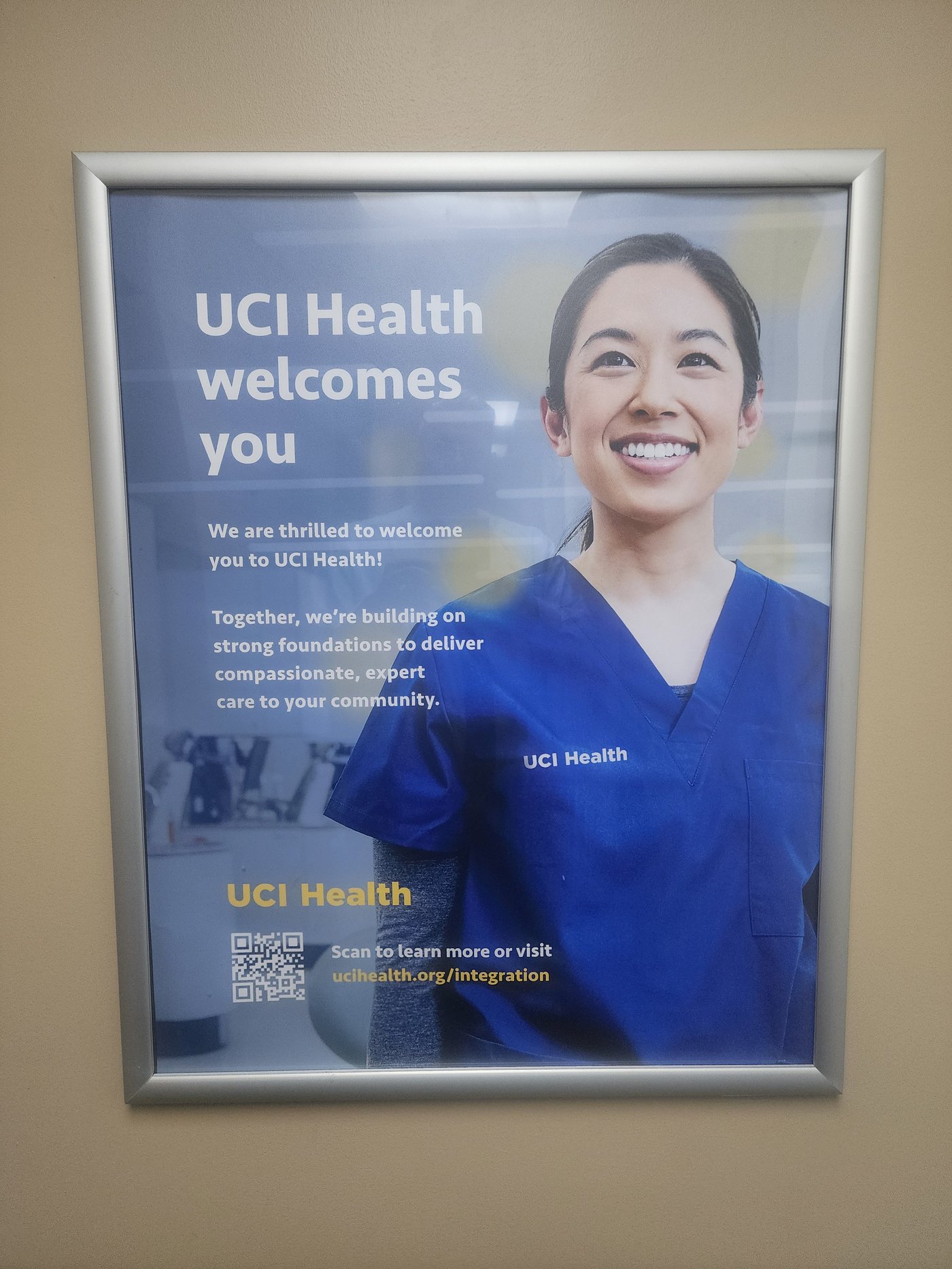 UCI Health welcomes you — framed poster installed in clinical environment for internal staff audience